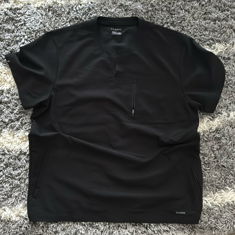 Barely used Jaanuu scrub top. Mens black